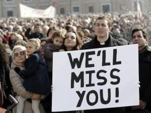 A priest displays a placard in St. Peter's Square at the Vatican 