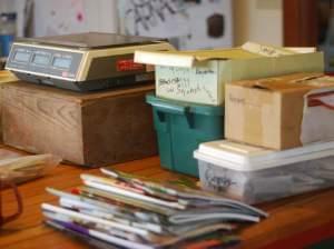 A scale and several seed catalogs