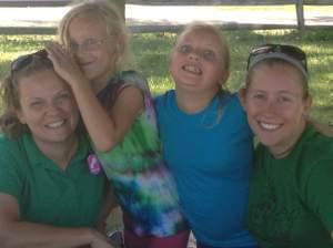 Katie Nolan is pictured on the far left with campers at Camp Peairs near Bloomington.