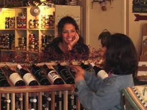 a woman shopping for wine