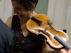 Violinist Amandine Beyer holds Mozart's own violin backstage at Boston's Jordan Hall on Monday.