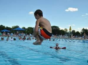 a child doing a cannonball at Sholem Aquatic Center 