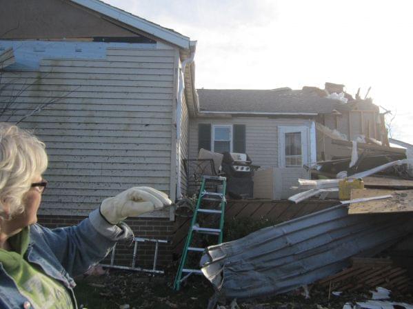 Mary Sutherlin looks at what's left of her home Tuesday, November 19 in Gifford. 