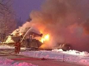 Firefighters work to put out the blaze  on Dec. 17, 2013.