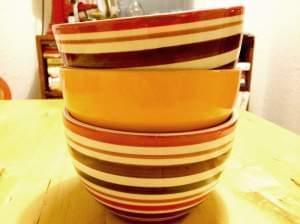 A stack of bowls on a kitchen table.