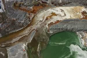 Coal ash spill into a river