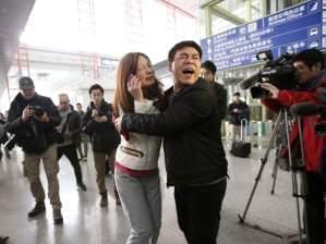 Woman believed to be relative of passenger of Malaysia Airlines flight cries 