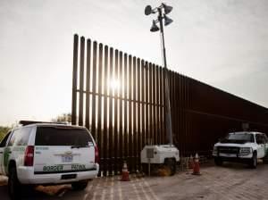 United States border patrol agents monitor a fence in Hidalgo, Texas. Two congressmen, from Texas and New Mexico, are seeking a review of some agency policies.