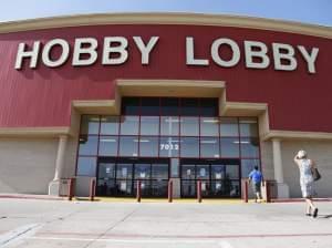 Customers walk into a Hobby Lobby store in Oklahoma City on Monday.