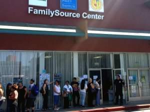 People line up at the FamilySource Center in Los Angeles, an organization in one of President Obama's five designated "Promise Zones" that aims to help fight poverty in the area.