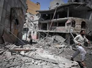 Palestinians walk through the rubble of houses in Gaza City minutes after they were hit in an Israeli strike on Wednesday.