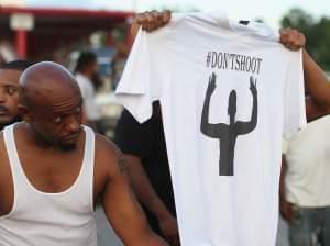 Demonstrators protest killing of Michael Brown, 18, in Ferguson, MO.