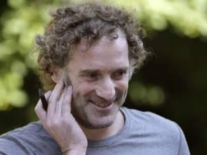 Peter Theo Curtis talks with reporters outside his mother's home in Cambridge, MA. 