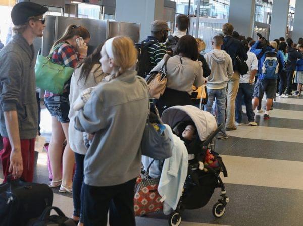 Travelers lined up Friday at O'Hare International Airport.