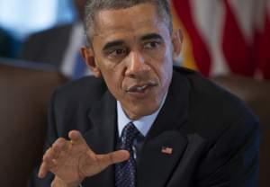 President Obama addresses the media Friday before a meeting with cabinet members.