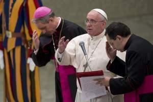 Pope Francis delivers his blessing at the end of a special audience held at the Vatican Saturday.