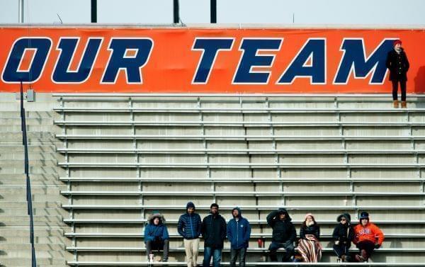 A few Illinois fans remain in the stands of Saturday's game at Memorial Stadium.