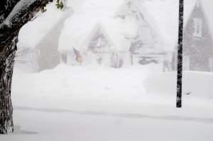 A house is obscured by lake effect snow Tuesday.