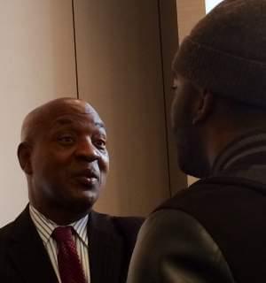 Harvard Law Professor Charles Ogletree speaks with a lecture attendee Wednesday at the U of I.