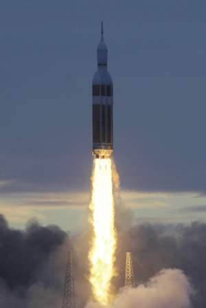 A rocket carrying NASA's Orion space capsule lifts off for its first unmanned orbital test flight at Cape Canaveral, Fla.