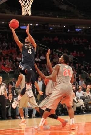 Villanova's Darrun Hilliard scores as Illinois' Rayvonte Rice looks on.