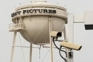 Security cameras stand across the street on Culver Boulevard in Culver City, California.