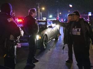 A protester shouts at police in Berkeley on Christmas Eve night.