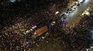 Emergency vehicles navigate the New Year's Eve crowd in Shanghai