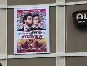 A poster advertising The Interview hangs on the back wall of the Alamo Drafthouse Cinema