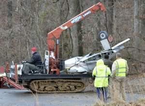 Salvage workers clearing site of plane crash