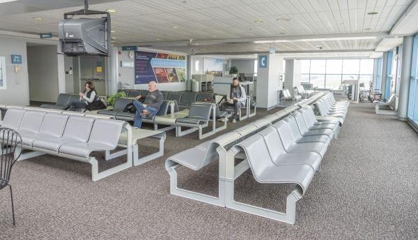 Passengers wait in the terminal for flights out of WIllard Airport.Passengers wait in the terminal for flights out of WIllard Airport.