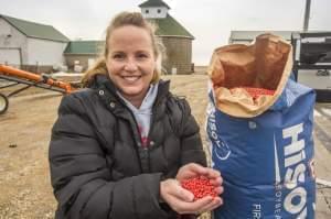 Farmer Jenny Mennenga holds soybean seeds at her family farm near LeRoy, Ill., on Jan. 26, 2015.