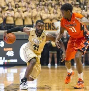 Purdue guard Rapheal Davis makes a move on Illinois forward Austin Colbert during the second half of  Saturday's 63-58 loss at Purdue.