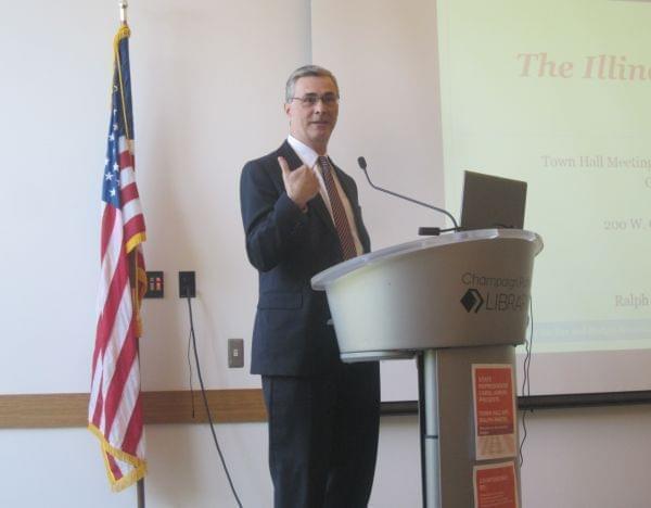 Ralph Martire of the addressed a large crowd with his fiscal plan at a town hall meeting in Champaign Monday.