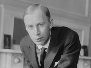 Black and white photo of a man in a living room
