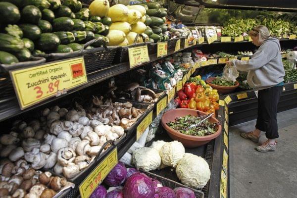 A customer shops for produce at the Hunger Mountain Co-op on Tuesday, April 16, 2013 in Montpelier, Vt. Vermont's 17 food cooperatives are supporting a bill that would require the labeling of genetically modified foods. The co-ops said Tuesday t