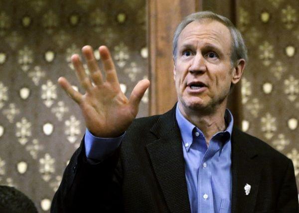 Illinois Gov. Bruce Rauner speaks to cabinet members during a meeting at the state Capitol, Feb. 25  in Springfield,