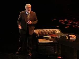 A man singing on an opera stage