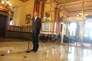 Gov. Bruce Rauner holds a press conference in early July, as Illinois began the new fiscal year without a budget.