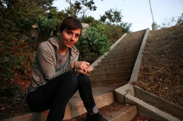 Jessica Hopper sitting on an outdoor staircase