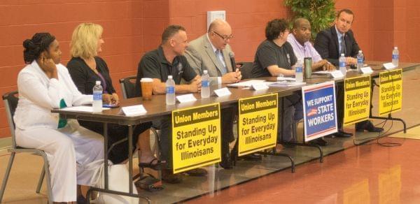 Illinois AFL-CIO President Michael Carrigan is joined by union members at a Springfield event. Also present was State Sen. Andy Manar, Andrew Fuchs is third from left.