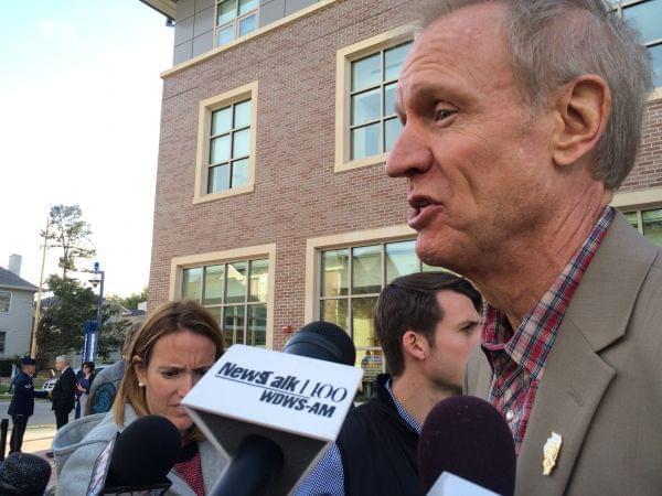 Gov. Bruce Rauner talks with media after celebrating the opening of a new Veterans Center on the U of I campus Oct. 2. Rauner appeared at U of I the day after college presidents sent the governor a letter asking for state support of universities.
