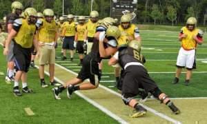 High school football team practicing