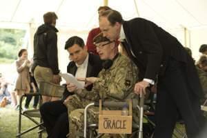 Bruce (middle) discussing protocol with Rob James-Collier (Tomas, left) and Kevin Doyle (Mr. Mosley, right).