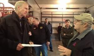 Gov. Bruce Rauner talking with Douglas County EMA Director Joseph Victor 