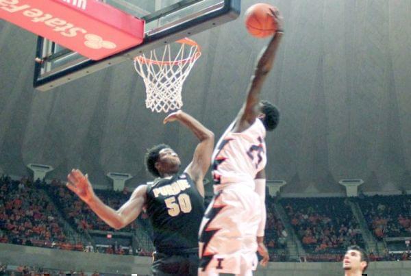 Illini guard Kendrick Nunn dunks overe Purdue's Caleb Swanigan.