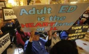 Supporters of education funding rally in the rotunda at the Illinois State Capitol Tuesday, April 12, 2016, in Springfield, Il. Illinois Gov. Bruce Rauner has released figures breaking down how much each Illinois school district would receive next ye