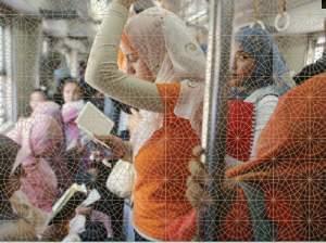 Muslim women ride the subway