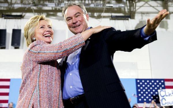 n this July 14, 2016, file photo, Democratic presidential candidate Hillary Clinton, accompanied by Sen. Tim Kaine, D-Va., speaks at a rally at Northern Virginia Community College in Annandale, Va. Clinton has chosen Kaine to be her running mate