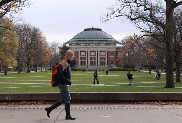 In this Nov. 20, 2015 file photo, University of Illinois students walk across the Main Quad on campus in Urbana, Ill. On Thursday, Jan. 21, 2016, university trustees approved a tuition freeze for instate freshmen. 